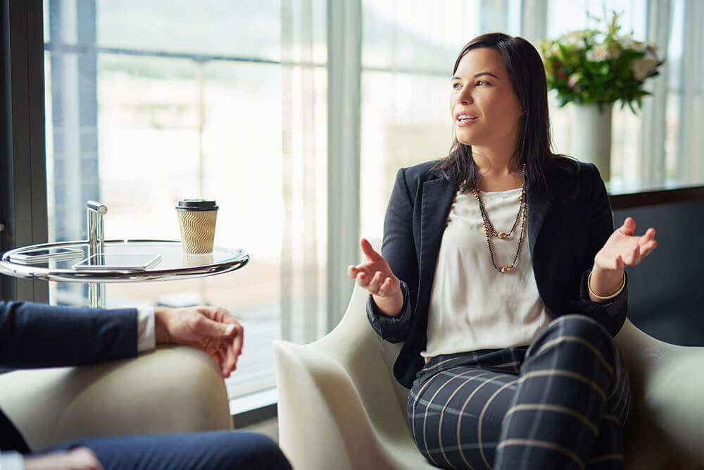 Professional woman sitting and talking